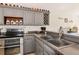Functional kitchen with ample counter space, stainless steel appliances, and custom storage at 230 Fareham Dr, Venice, FL 34293