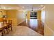 Spacious living room with light walls, tile and wood floors, fan and view to the screened patio at 230 Fareham Dr, Venice, FL 34293