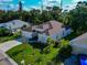 A lovely home featuring an inviting backyard with well-maintained greenery and beautiful landscaping at 230 Fareham Dr, Venice, FL 34293