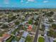 Aerial view of a neighborhood with tree lined streets, nearby ocean, and home marked with location pin at 2312 Emory Ave, Bradenton, FL 34207