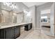 Bathroom with double vanity, ample counter space and view to Primary bedroom at 23233 Banbury Way # 302, Venice, FL 34293