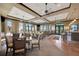 Spacious dining room with neutral decor, ample natural light, and comfortable seating at 23233 Banbury Way # 302, Venice, FL 34293