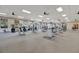 Large gym with weight machines, modern carpet, and ample natural light at 23233 Banbury Way # 302, Venice, FL 34293