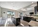 Open concept kitchen with an island, granite countertops, stainless steel appliances, and breakfast nook at 23233 Banbury Way # 302, Venice, FL 34293