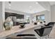 Kitchen boasting marble countertops, barstool seating, and easy access to the dining area at 23233 Banbury Way # 302, Venice, FL 34293