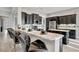 Kitchen boasting marble countertops, barstool seating, and ample cabinets at 23233 Banbury Way # 302, Venice, FL 34293