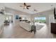 Open-concept living and dining area with a spacious living room, balcony access, and sleek design at 23233 Banbury Way # 302, Venice, FL 34293