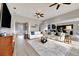 Bright living room with a comfortable sectional and easy access to the kitchen at 23233 Banbury Way # 302, Venice, FL 34293