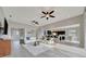 Bright living room with a comfortable sectional and easy access to the kitchen and dining areas at 23233 Banbury Way # 302, Venice, FL 34293
