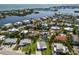 Scenic aerial view of a waterfront community with a beautiful bay in the background at 237 85Th St, Holmes Beach, FL 34217