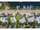 Aerial of waterfront properties with private docks and lush landscaping and swimming pools at 237 85Th St, Holmes Beach, FL 34217