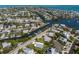 Expansive aerial view of a coastal community featuring homes along waterways with boat docks at 237 85Th St, Holmes Beach, FL 34217