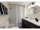 Chic bathroom features modern vanity, contrasting finishes and stylish fixtures at 237 85Th St, Holmes Beach, FL 34217