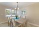 Lovely dining room offering a four-seat dining table and a large bright window at 237 85Th St, Holmes Beach, FL 34217