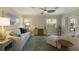 Comfortable living room with soothing colors, accent pillows, and large windows at 237 85Th St, Holmes Beach, FL 34217