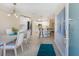 Open-concept layout showcasing a dining area that flows into a kitchen with a breakfast bar and modern finishes at 237 85Th St, Holmes Beach, FL 34217