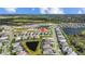 Community aerial view showcasing ponds, single-Gathering homes, and lush landscapes in a well-planned neighborhood at 2578 Wild Cherry Path, Sarasota, FL 34240