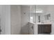 Modern bathroom features a tiled shower with glass partition and double vanity with sleek fixtures at 2578 Wild Cherry Path, Sarasota, FL 34240