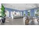 Modern clubhouse kitchen with large island, seating, and contemporary finishes perfect for community events and gatherings at 2578 Wild Cherry Path, Sarasota, FL 34240
