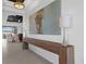Inviting entryway showcasing a wood console table and modern artwork at 2578 Wild Cherry Path, Sarasota, FL 34240