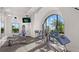 Bright fitness center featuring modern exercise equipment and large windows with a lush view at 2578 Wild Cherry Path, Sarasota, FL 34240