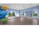 Spacious studio with a wall of mirrors, large windows, and exercise balls at 2578 Wild Cherry Path, Sarasota, FL 34240