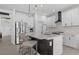 Modern kitchen featuring stainless steel appliances, white cabinets and a center island at 2578 Wild Cherry Path, Sarasota, FL 34240