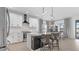 Modern kitchen with stainless steel appliances, white cabinets, and a center island at 2578 Wild Cherry Path, Sarasota, FL 34240