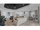 Bright and airy open-concept living space features a black ceiling, modern decor, and ample natural light at 2578 Wild Cherry Path, Sarasota, FL 34240