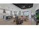 Open-concept living space features a gourmet kitchen, dining area, and comfortable living room for seamless living at 2578 Wild Cherry Path, Sarasota, FL 34240