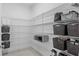 Walk-in pantry with ample shelving for organized storage and provisions at 2578 Wild Cherry Path, Sarasota, FL 34240