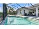 Inviting swimming pool with a screened enclosure and patio area, perfect for outdoor living at 2578 Wild Cherry Path, Sarasota, FL 34240