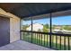 Screened balcony offering outdoor views of green spaces and neighboring properties at 2704 Hidden Lake Blvd # C, Sarasota, FL 34237