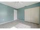 Bright bedroom with neutral paint, tile floors, and ample closet space at 2704 Hidden Lake Blvd # C, Sarasota, FL 34237
