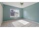 Bedroom with tile floors, window, and ample natural light at 2704 Hidden Lake Blvd # C, Sarasota, FL 34237