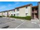 Well maintained exterior of a charming townhome with assigned parking spaces, perfect for comfortable living at 2704 Hidden Lake Blvd # C, Sarasota, FL 34237