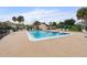 Enjoy the community pool with lounge chairs and a beautiful patio area, perfect for relaxation and socializing at 2704 Hidden Lake Blvd # C, Sarasota, FL 34237