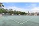 Well maintained tennis court with beautiful landscaping, perfect for recreational activities and sports enthusiasts at 2704 Hidden Lake Blvd # C, Sarasota, FL 34237