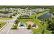 A serene community featuring a playground, pond with fountain, and well-maintained homes at 2721 Greenleaf Ter, Parrish, FL 34219
