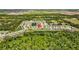 This aerial view shows how this community is set among ponds, green spaces and wooded areas at 2721 Greenleaf Ter, Parrish, FL 34219