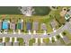 An aerial shot shows the home's proximity to the pond, and the layout of the neighborhood at 2721 Greenleaf Ter, Parrish, FL 34219