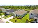 This beautiful home is surrounded by green grass and has a small pond in the back at 2721 Greenleaf Ter, Parrish, FL 34219