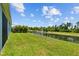 The backyard features a picturesque pond with a fountain and lush landscaping at 2721 Greenleaf Ter, Parrish, FL 34219