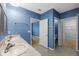 The bathroom features double sinks, with doors leading to bedroom and closet at 2721 Greenleaf Ter, Parrish, FL 34219