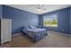 This bedroom features a window view, ceiling fan, and carpet at 2721 Greenleaf Ter, Parrish, FL 34219
