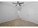 Bedroom features plush carpeting, a ceiling fan and neutral paint creating a serene atmosphere at 2721 Greenleaf Ter, Parrish, FL 34219