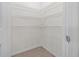 This closet features tile floors, white wire shelving and lighting at 2721 Greenleaf Ter, Parrish, FL 34219