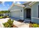 Charming single-story home with a two-car garage and beautifully landscaped front yard at 2721 Greenleaf Ter, Parrish, FL 34219