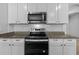 Well-equipped kitchen features stainless steel appliances and granite countertops at 2721 Greenleaf Ter, Parrish, FL 34219