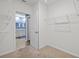 View into the walk-in closet with wire shelving and access to bathroom at 2721 Greenleaf Ter, Parrish, FL 34219